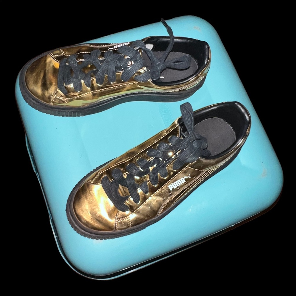 Gold Puma shoes
